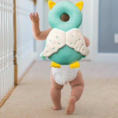 bébé rampant portant coussin de protection anti-choc headsafety dragon.