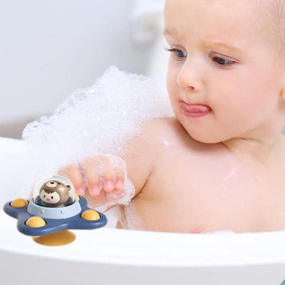 Jouet de bain tournant pour bébé fixé dans la baignoire avec sa ventouse.