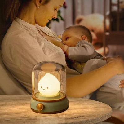 Veilleuse bébé Lumix illumine pendant maman allaite le bébé pendant la nit.